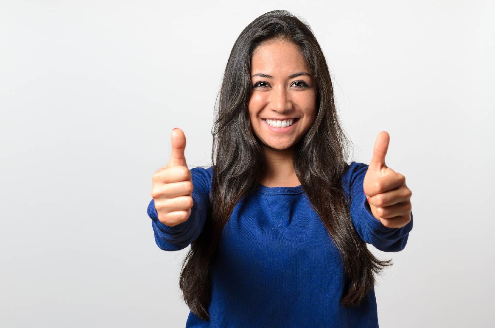 Healthcare professional indicating success with a thumbs-up gesture.